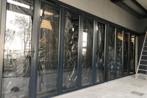 Long aluminium entrance with glass door installed by 3MC Services Durban