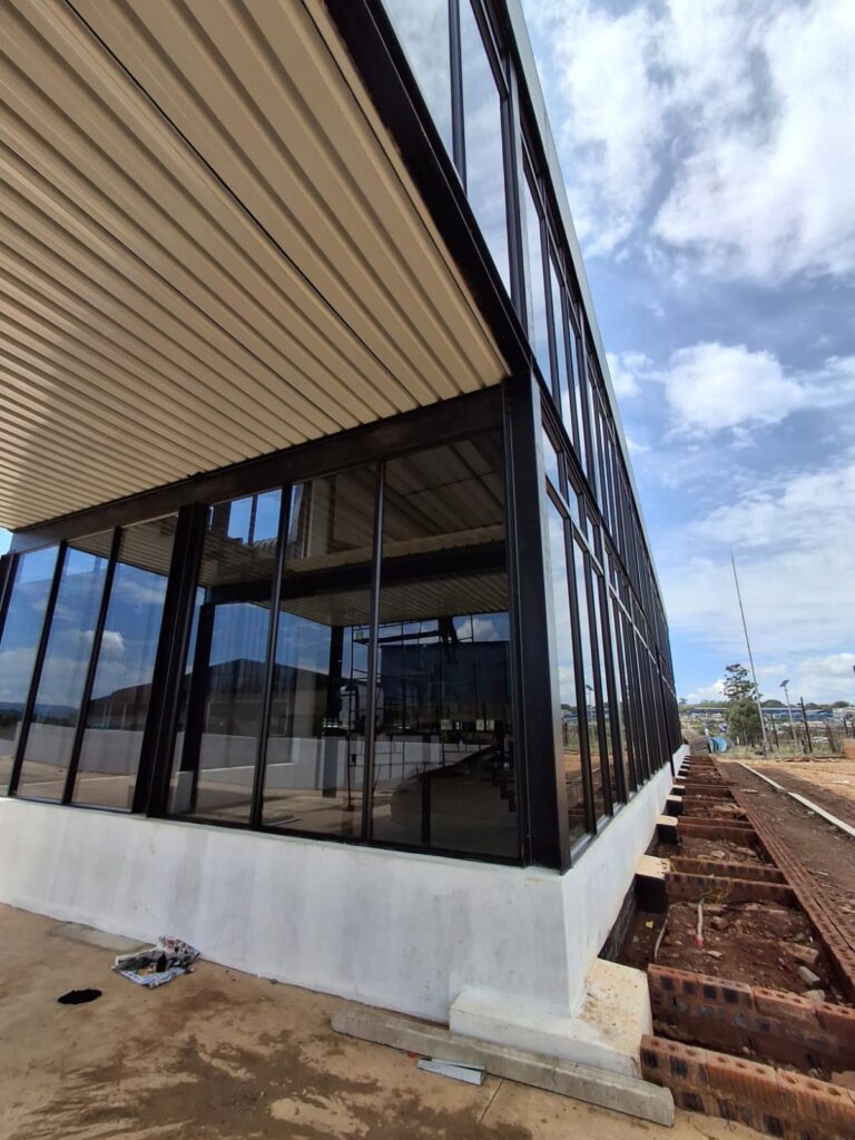 Completed aluminium curtain wall and glass installation at Mbageni commercial development, KZN